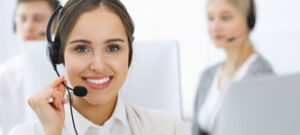 female customer service agent takes a call using her headset American VA Loans